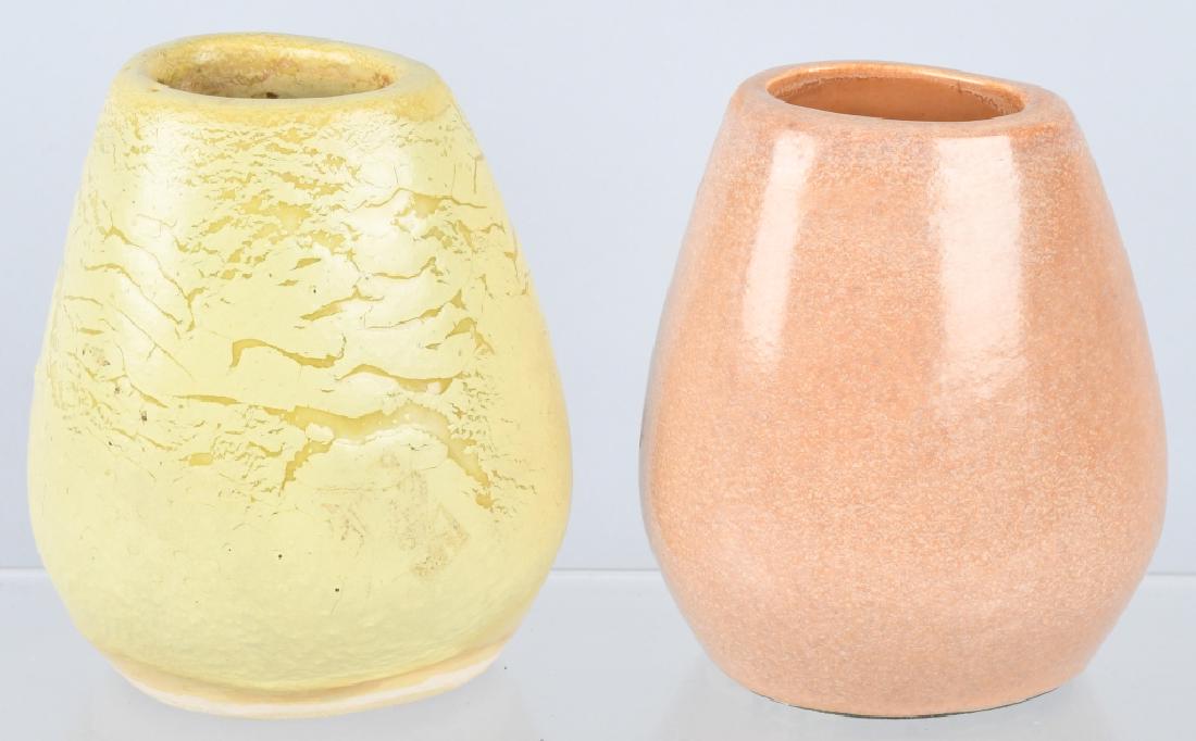2-RUSSEL WRIGHT BAUER ART POTTERY VASES: Russel Wrights American Modern line of pottery was introduced in 1939. This is a nice lot of 2 small art pottery vases. The largest is 5" by 4". Both are marked Russel Wright Bauer underneath. Excelle