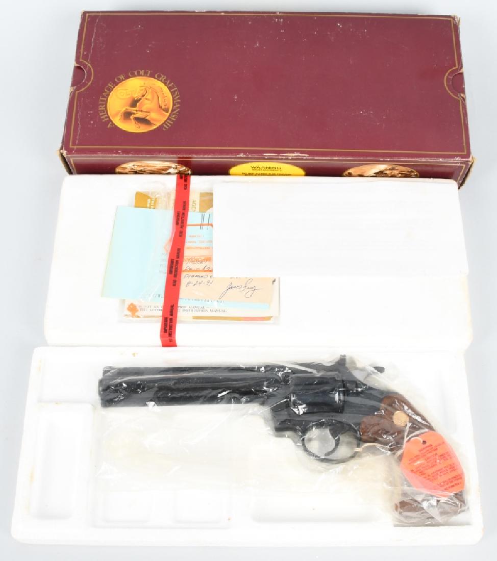 COLT DIAMONDBACK, .22 REVOLVER BOXED: SN AA06982, 6" vented rib barrel. .22 caliber, 100% finish, mint checkered grips. Gun is like new. Includes original box and paperwork. Serial numbers match on gun and box. Excellent-Near Mint*