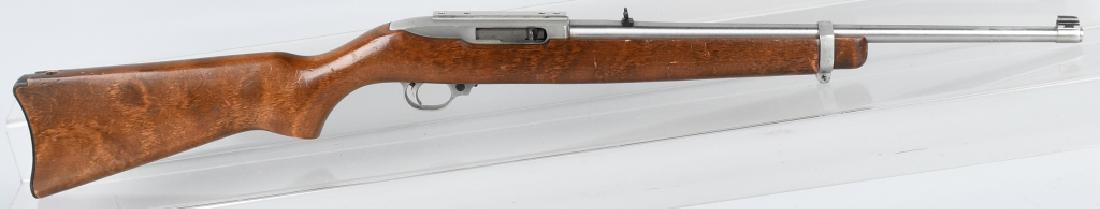 RUGER MODEL 10/22, .22 LR CARBINE: SN 239-34221. 18" barrel with excellent. Stainless finish has handling marks. Very good stock, and good action. Has importers stamp. Very Good-Excellent*