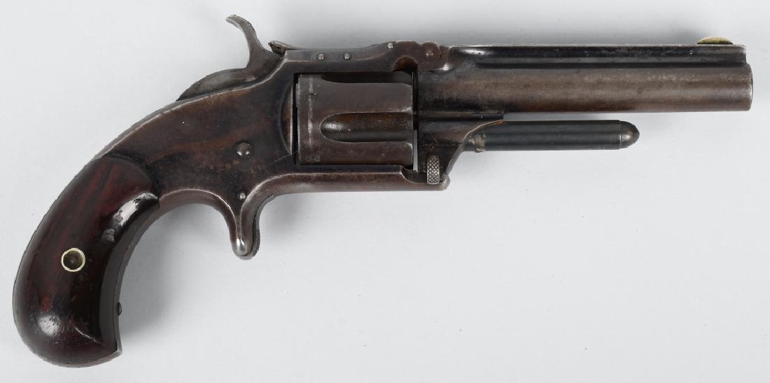 SMITH & WESSON 1 1/2, .32 REVOLVER: SN 46771, MFG 1868-1875, 3 1/2" barrel with very good bore. Traces of blue finish in protected areas, and blue turning brown. Smooth metal with nice markings, excellent birds head grips. Works and loc