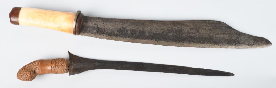INDONESIAN KRIS DAGGER & PHILIPPINE KNIFE - BOLO: Dagger/knife lot includes" 1. Indonesian Kris 15.5" dagger with an 11.75" blade and beautifully carved wood handle; 2. A 19.25" bone handled bolo with a 13.75" blade that could be of Philippines origi