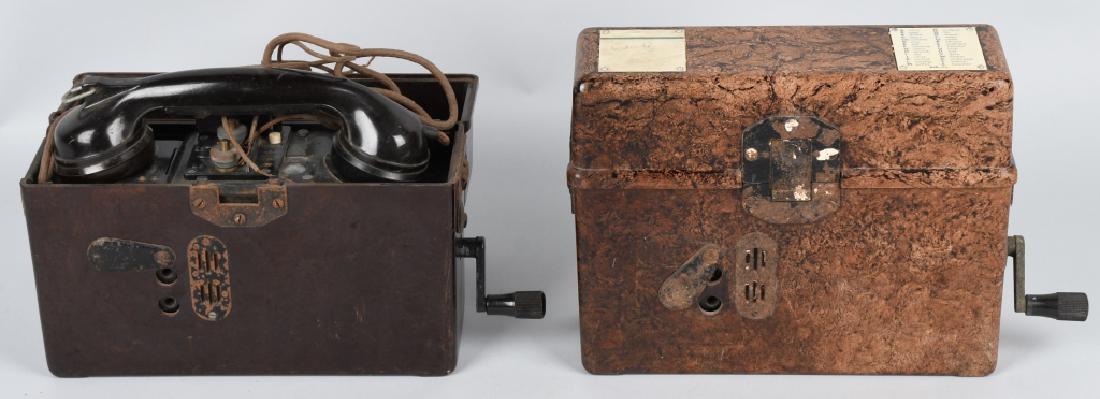 WWII NAZI GERMAN BAKELITE FIELD TELEPHONES (2): Two World War Two German Bakelite field telephones. The first phone is complete with oxidation on the exterior metal parts. very good. The second phone appears complete from the exterior but the metal