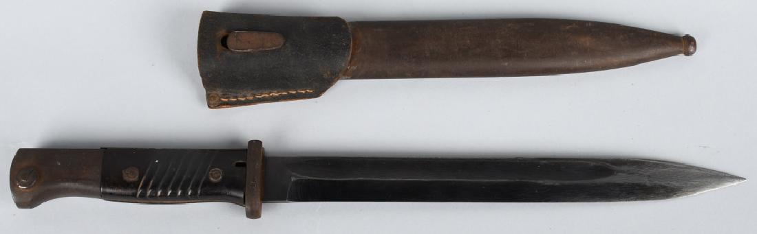 WWII MAUSER K-98 BAYONET & SCABBARD: German WWII Mauser K-98 Combat Bayonet & Scabbard. Measures 16" long overall. The blued steel blade is maker marked 'WKC'. The blade and scabbard are un numbered. Includes a partial leather belt frog.