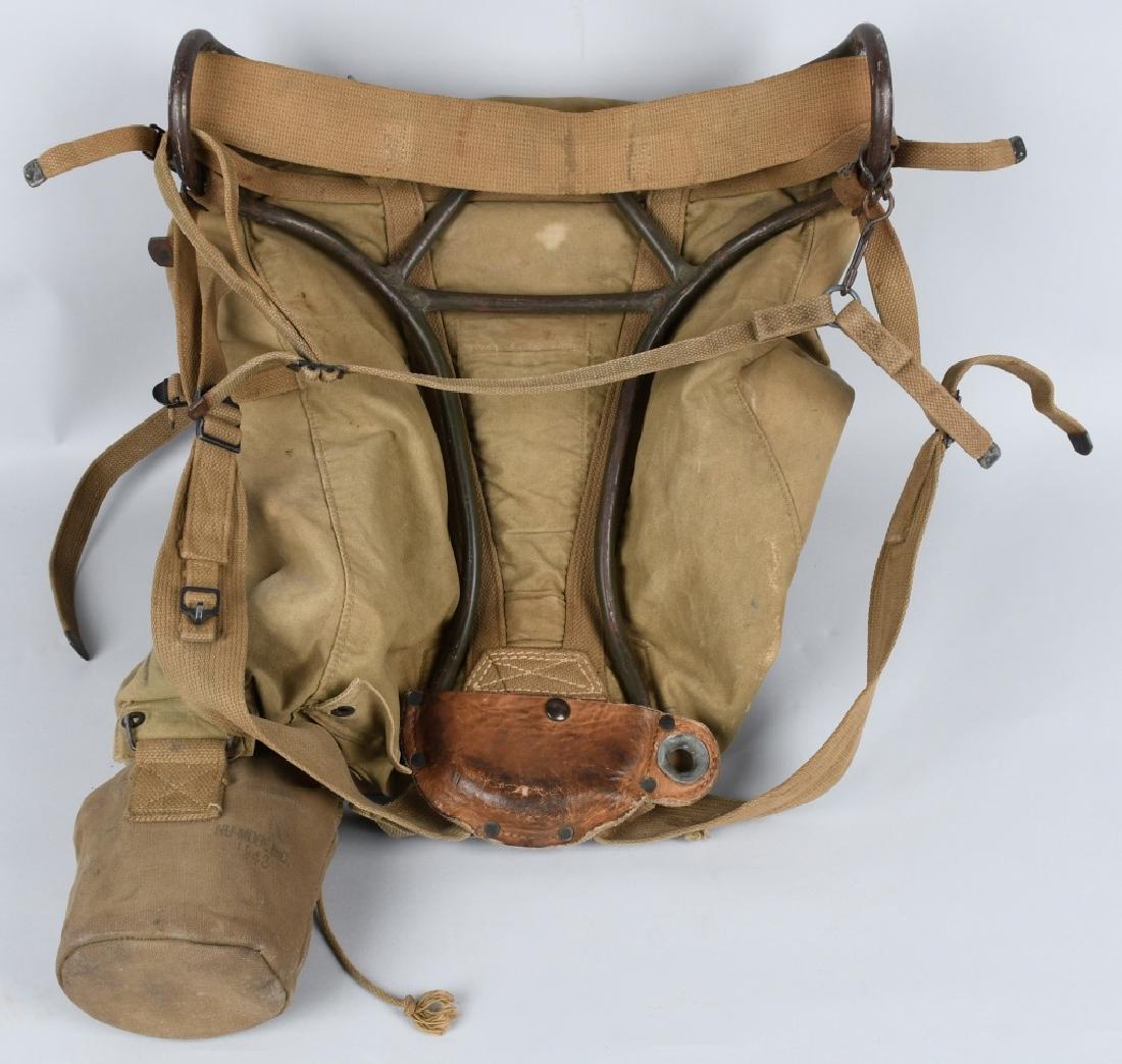 WWII U.S. AVERY BACK PACK AND CANTEEN: World War Two backpack made by Avery and dated 194_. Attached is a canteen stamped U.S. Massillon Al. Co 1945. The cup is made by the E.A. Co. 1944. Very good condition with no rips or holes.