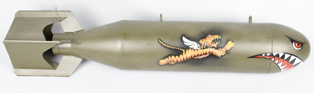 WWII M 38A2 PRACTICE BOMB - INERT: World War Two M38A2 practice bomb. This bomb has been repainted with a flying tiger motif and is excellent for display. The color of this practice bomb originally was a powder blue color to quickly di