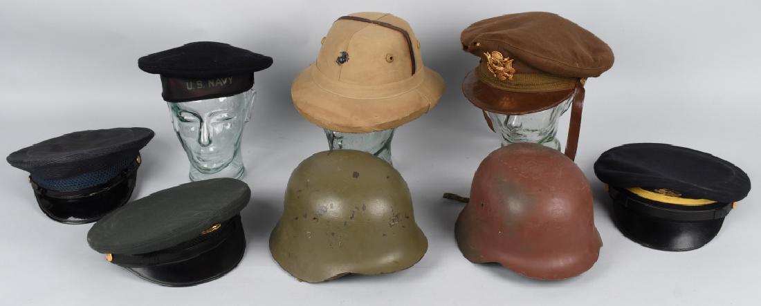 MILITARY HAT LOT INC. FOREIGN HATS & WWII U.S.: Lot of 8 pieces of military headgear including U.S. WWII officer's visor cap, Navy hat with tassel, Pith helmet with USMC Marines EGA with maker's mark Special sunproof hat made in India, 2 German pos