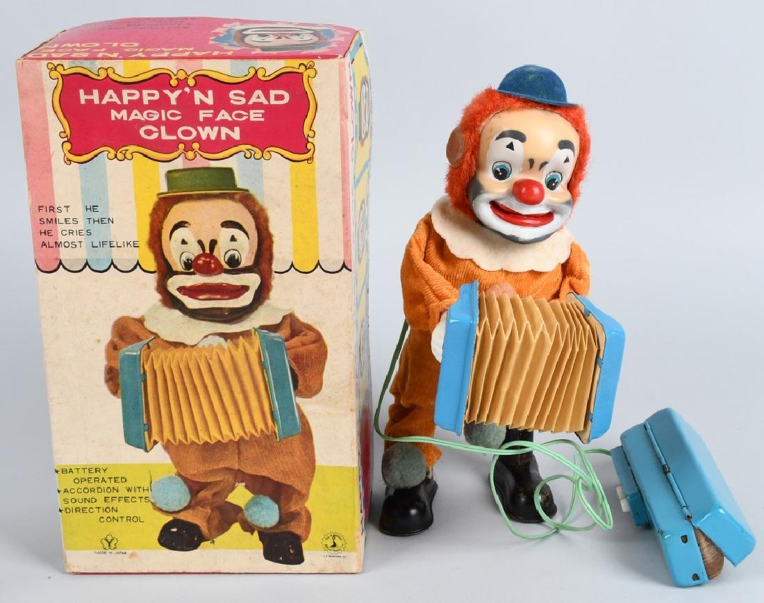 JAPAN Battery Op HAPPY 'N SAD CLOWN, BOXED: All original colorful Happy 'N Sad Magic Face Clown with the original box. Great action and worked when tested. Box has a couple of tears, and a hole in the bottom. 10 1/2" Excellent