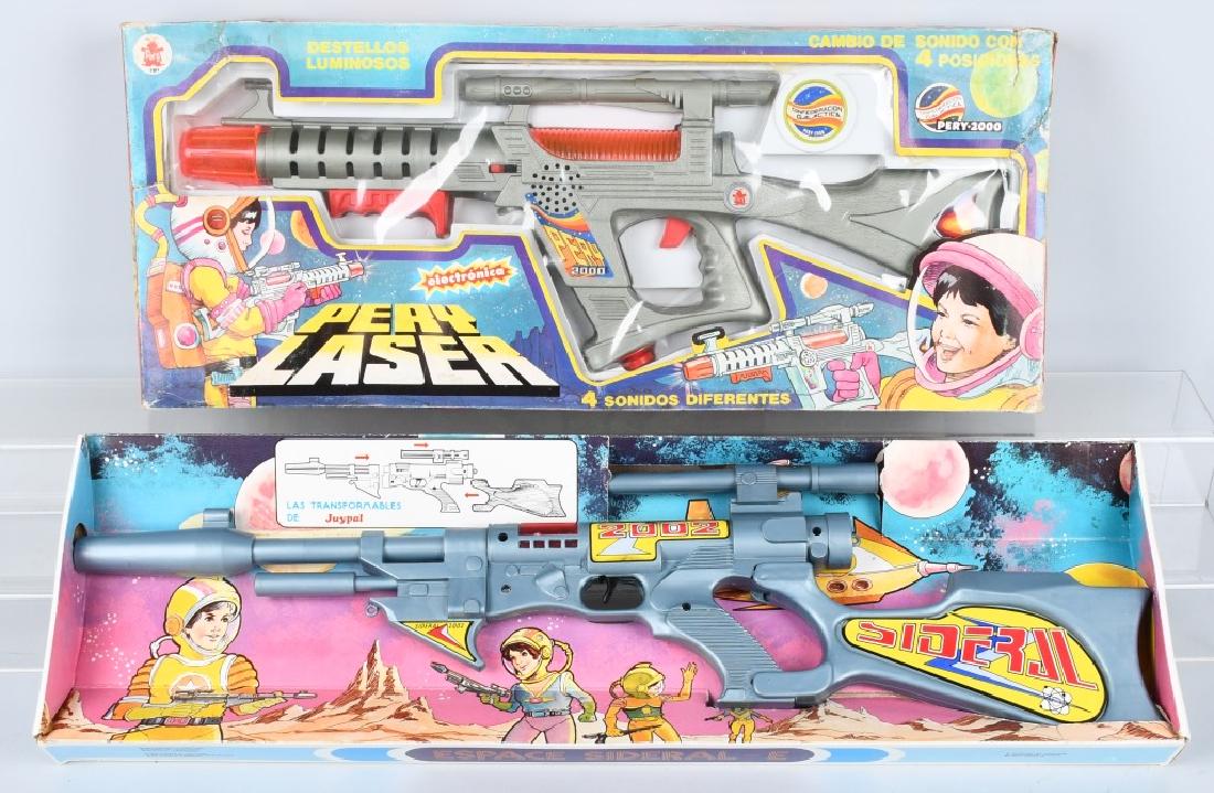 2- SPACE GUNS Made in SPAIN w/ BOX: Includes Espace Sideral-E Friction Space Gun and Pery Laser Battery Operated Space Gun. Both with Boxes. Largest measures 28" Excellent