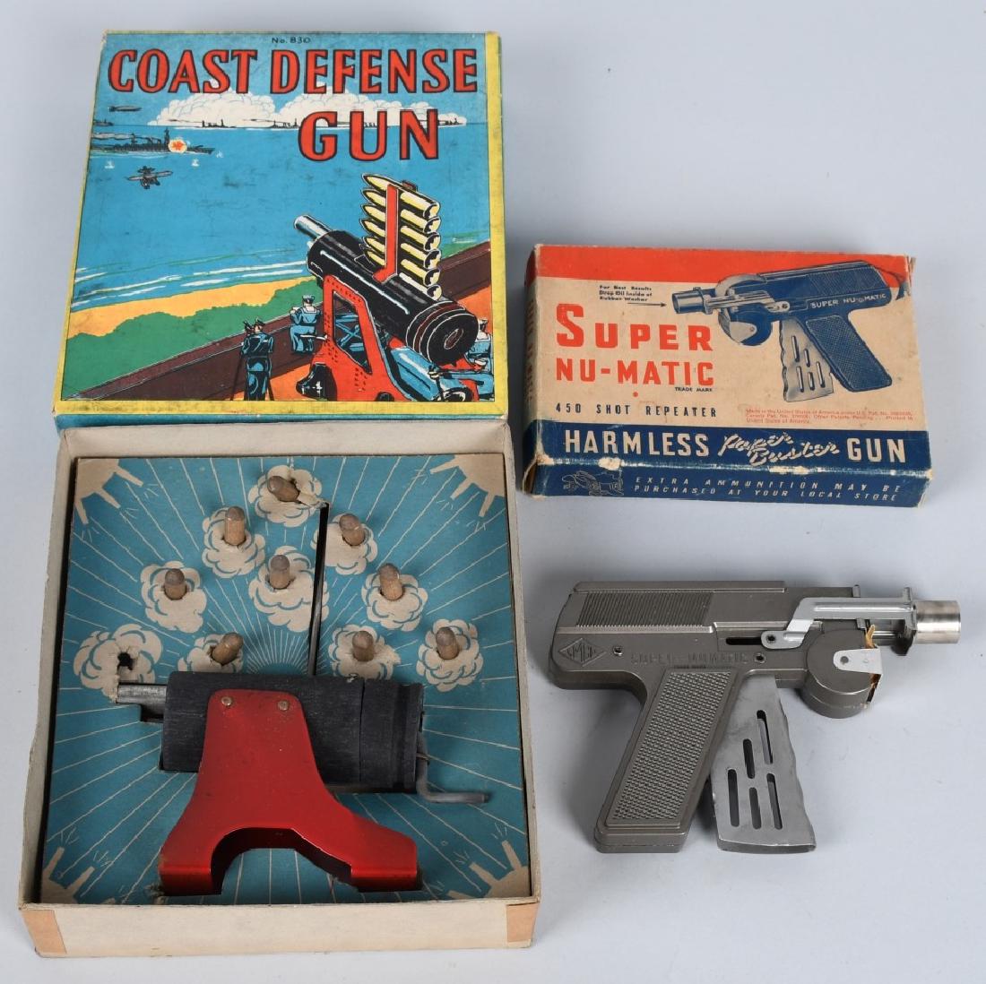 COASTAL DEFENSE & SUPER NU-MATIC GUNS w/ BOX: Includes Baldwin Coastal Defense Gun complete with bullets Boxed and Langson Super Nu-Matic paper buster gun Boxed. Excellent