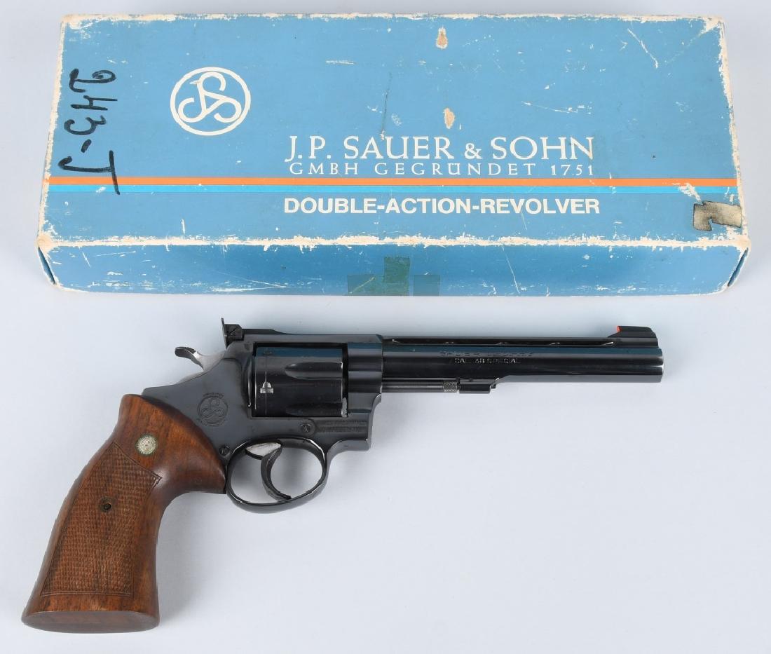 GERMAN J.P SAUER "TROPHY" .38 REVOLVER, BOXED: SN N00688, 6" vented rib barrel with excellent bore. .38 Special caliber. 97% blue finish with excellent walnut checkered grips. Smooth action locks up tight. Includes original box and factory test ta