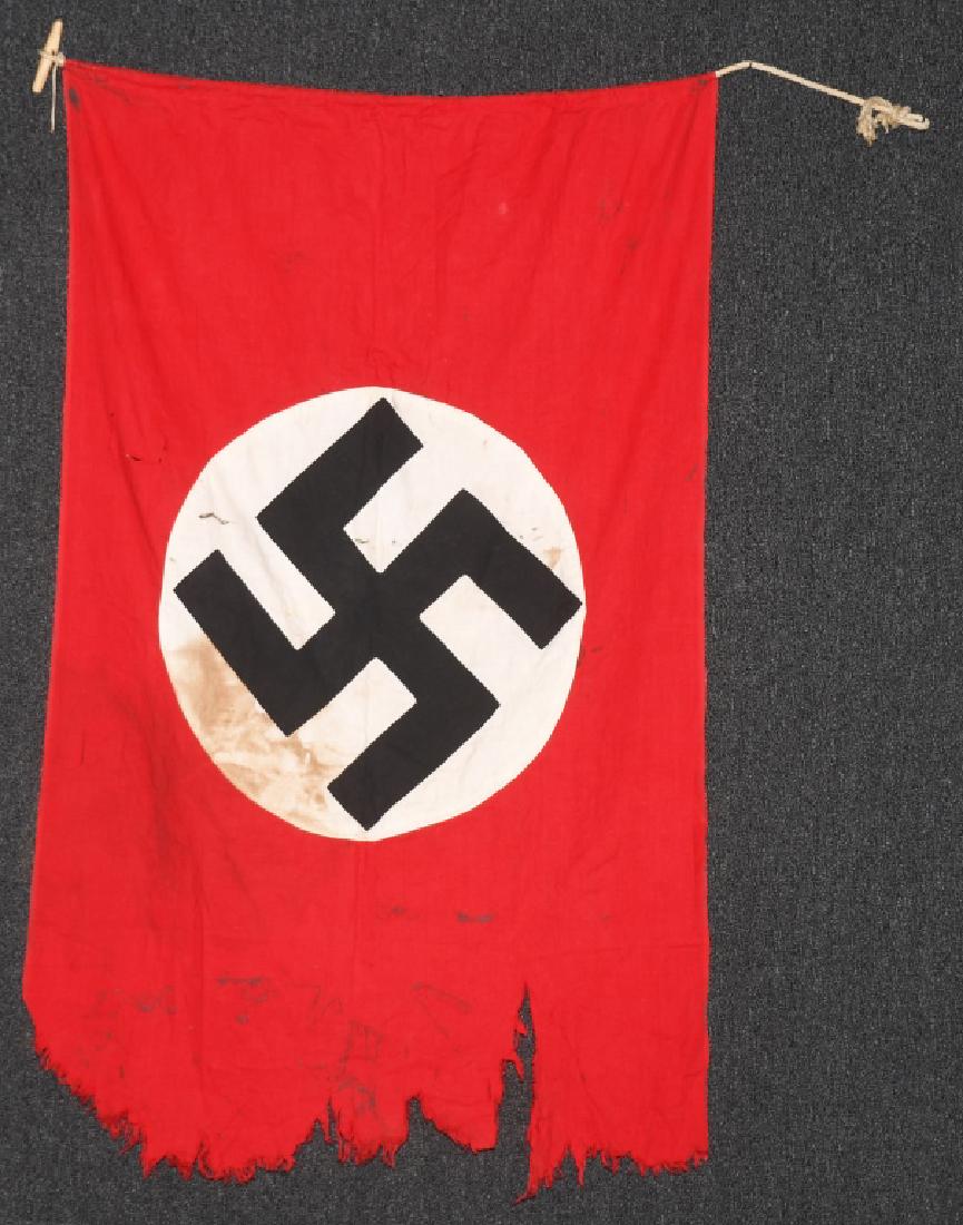 WWII NAZI GERMAN PARTY FLAG: Two sided multi-piece construction Nazi party flag. Flag does have staining a few rips and the fly end is tattered. Flag measures 28.5" X 47". good.