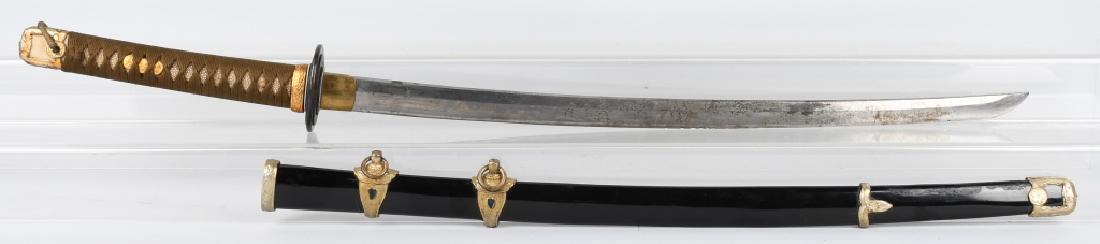 WWII JAPAN NAVAL KAI GUNTO KATANA, signed TANG: 33" overall with 23 3/4" cutting edge. Blade has pitting, edge nicks, and evidence of sharpening. One hole tang is signed on both sides. The habaki and tsuba are brass. Grip is complete with shark ski