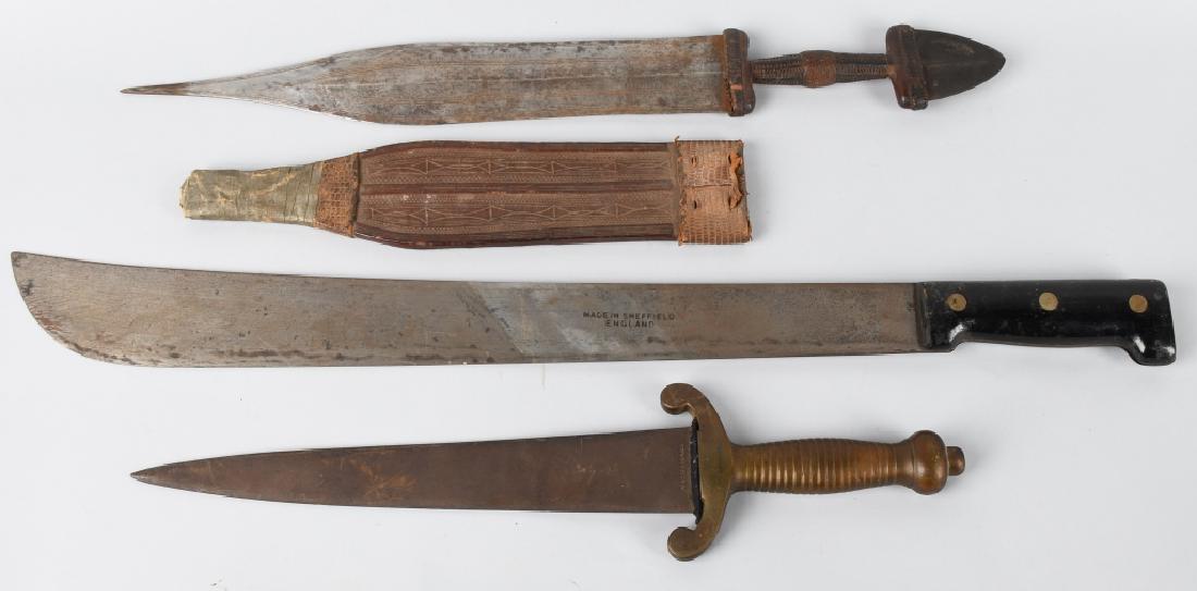 3-VINTAGE BLADES, GERMAN, ENGLISH & AFRICAN: Lot includes a 15 1/2" side knife with cast brass hilt. Blade is marked Made in Germany, a 23" machete marked Made in Sheffield England, along with a 18 1/2" vintage African 2 blade knife with leather