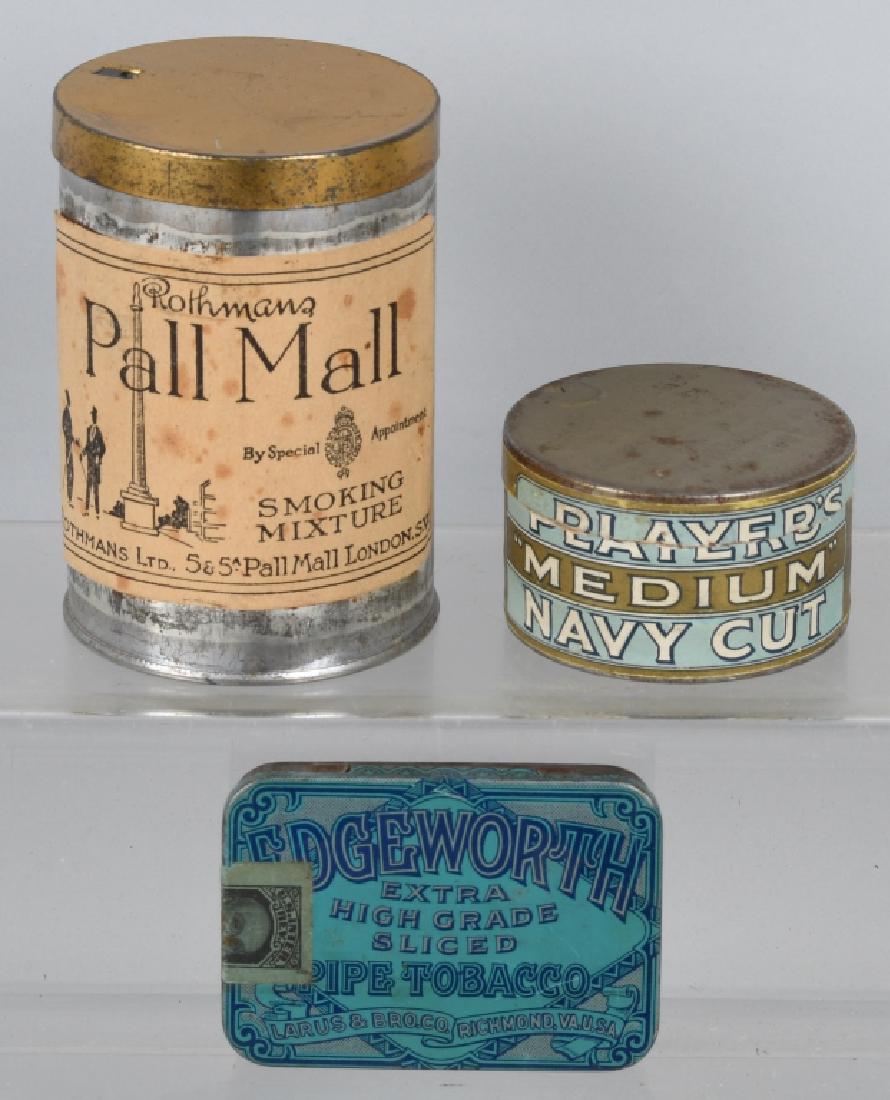 WWII ERA BRITISH & U.S TOBACCO TINS - TWO UNOPENED: Two full unopened tins of British tobacco including a tin of Rothmans Pall Mall smoking mixture, London, and John Player's & Sons Navy cut medium tobacco. Also included is an empty Edgeworth, Richmond