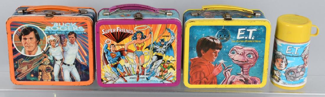SUPER FRIENDS, ET, & BUCK ROGERS LUNCH BOXES: Nice original lunch boxes. ET has thermos. All with edge war. Very Good