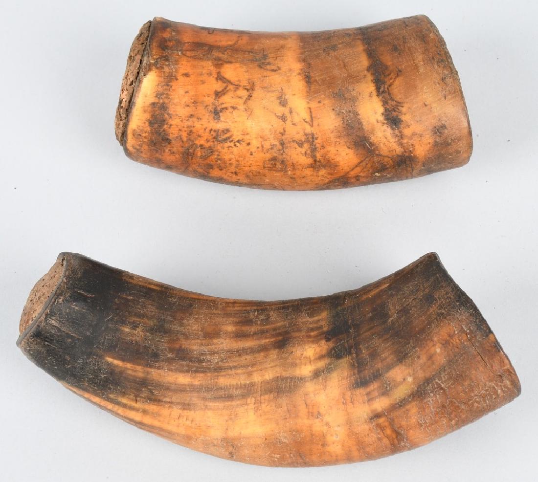 EARLY HORN CUP w/ SCRIMSHAW & MORE: Nice pair of early horn cups. One has scrimshaw work showing a ship, people, ostrich, and more. Cup with scrimshaw has some mothing. Largest measures 7" Very Good