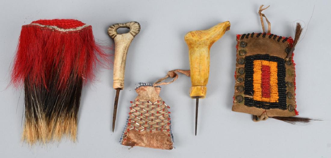 LOT OF NATIVE AMERICAN INDIAN ITEMS: Includes Buffalo Skull carved Bone Handle Pick, Foot carved Bone Handle Pick, Leather Beaded Medicine Pouch, Leather bead and stud Medicine Pouch, and Porcupine Dance Roach. Very Good-Excellent