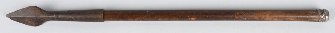 VINTAGE FISHING SPEAR, HAND FORGED HEAD: Head is blacksmith made and is lapped over cast iron 5 1/2". Shaft is wood with with silver cap on end. An unusual early piece. Very Good