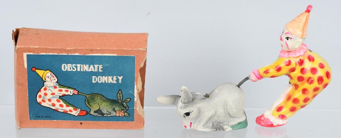 JAPAN CELLULOID WINDUP CLOWN & DONKEY, BOXED: Pre-war Japan celluloid windup clown and donkey. Great colors and action. Worked well when tested, no key is included/ Colorful original box is missing an end flap. 7" by 5 1/2", Excellent