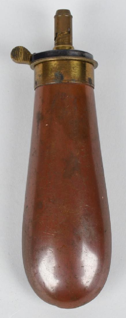 JAMES DIXON COPPER BAG GUNPOWDER FLASK: Original gunpowder flask marked James Dixon & Sons on brass top. Body of flask is copper. Has working lever spring. One small dent on side. excellent
