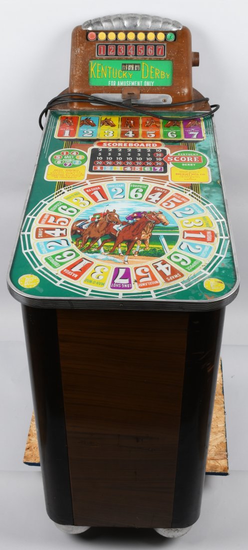 1950 BUCKLEY KENTUCKY DERBY ARCADE SLOT MACHINE: Scarce 1950 Buckley Kentucky Derby Arcade Slot Machine. All original with great colors and Horse racing graphics. Machine powers up and lights up. Accepts the coin and spins when button pushed. A uniq