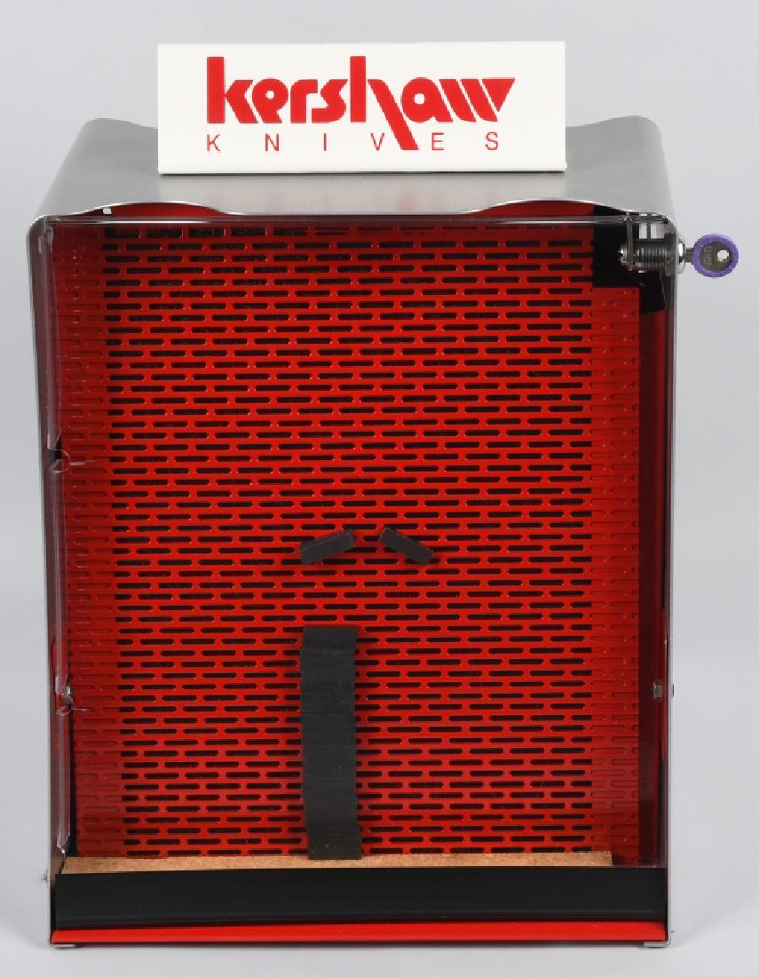 KERSHAW KNIVES ROTATING COUNTERTOP DISPLAY CASE: Kershaw knife case with painted metal and lucite window construction. Still has the original key. Knives attach to display walls by magnet - 40 magnets included. Rotates well. Measures 17" x 14". Exce