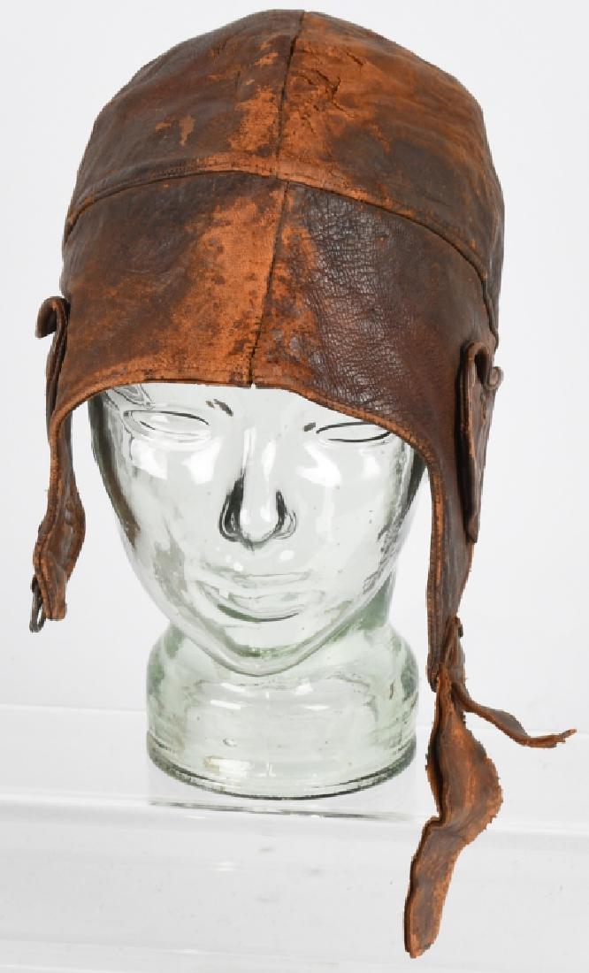 WWI U.S. ARMY AIR SERVICE PILOT SPALDING HELMET: World War One United States Army Air Service leather flight helmet made by A.G. Spalding & Bros. The Spalding maker label is sewn to the interior. Leather is supple with a few dry areas. 1.5" leather 