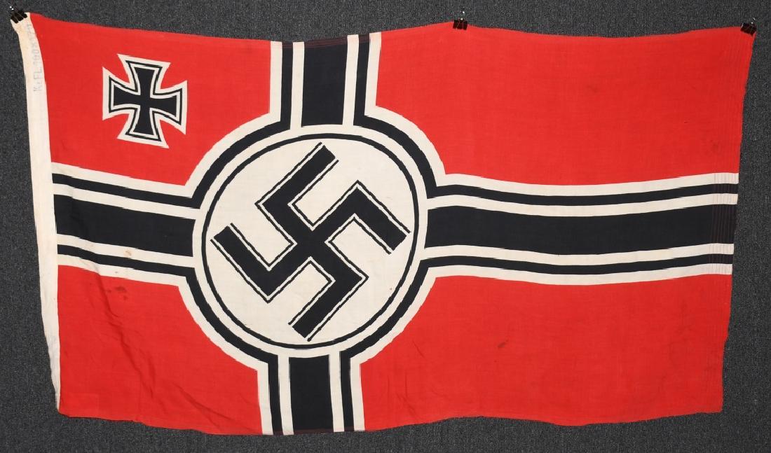 WWII NAZI GERMAN KRIEGSMARINE DUTCH MADE FLAG: Kriegsmarine flag made in Holland with reinforced corners at the hoist and 8 lines of stitched reinforcement at the fly end. Printing along the hoist reads Kr. FL. 100 x 170 (39 inches x 67 inches). P