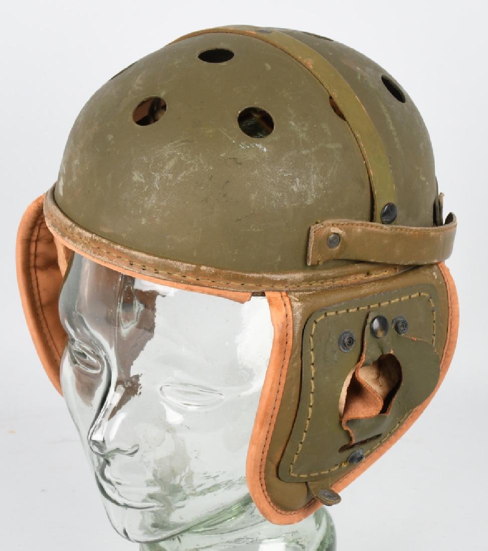 WW2 US M38 LEATHER TANKER HELMET BY RAWLINGS: US Army WWII M38 tanker Helmet size 7&1/8 complete with the rigid ear protection tabs (often missing or broken). The ear flaps are also complete and the liner is in excellent supple condition. Near mi