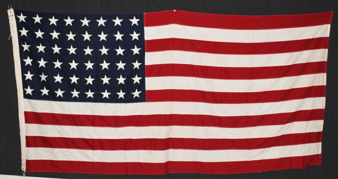 WWII US 48 STAR FLAG PHILADELPHIA Q.M. DEPOT: Mint unissued condition World War Two Philadelphia Quartermaster depot United States 48 star flag. Stars are separately applied. Flag depot markings are on the hoist. Flag measures 9.5 feet x 5 feet. 