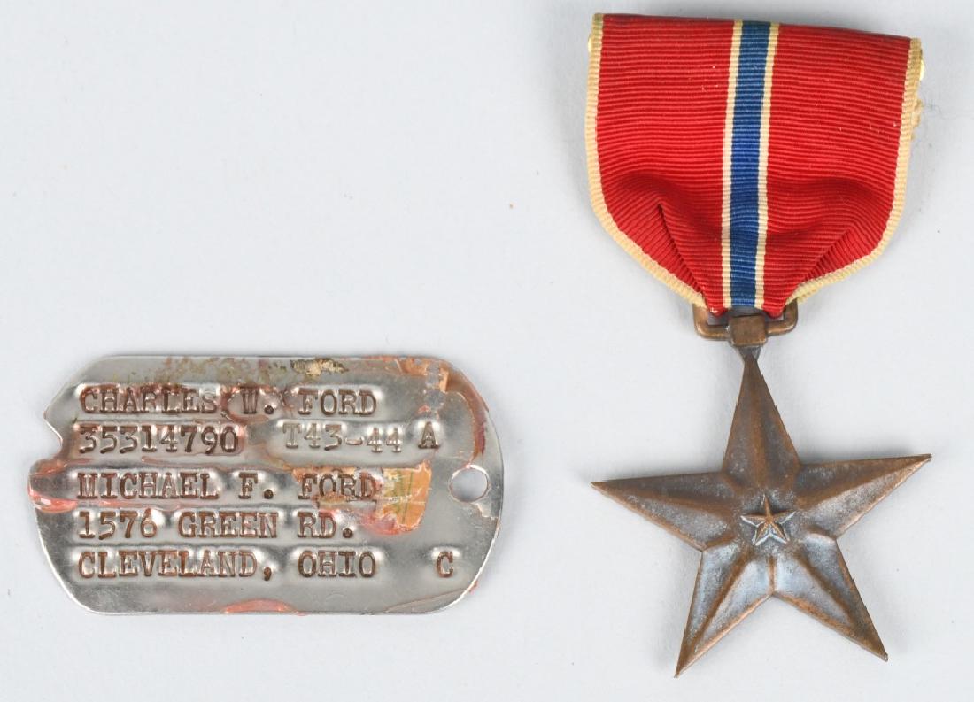 WWII U.S. ENGRAVED BRONZE STAR & DOG TAGS: World War Two Bronze Star Medal engraved to Charles W. Ford of Cleveland, Ohio. Also included is one of his dog tags. Estate find - no research done on this soldier. very good.