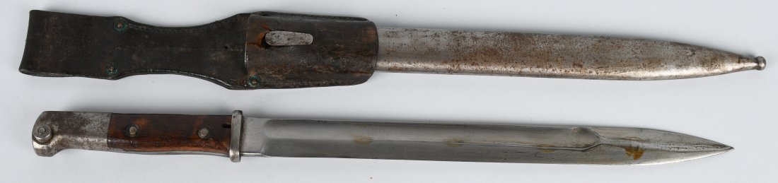 WWI K98 MAUSER BAYONET SCABBARD & FROG: K98 bayonet with scabbard & frog. Hallmarked on the spine. Partial stamping still visible on the frog. Leather tear were frog attaches to scabbard. very good.
