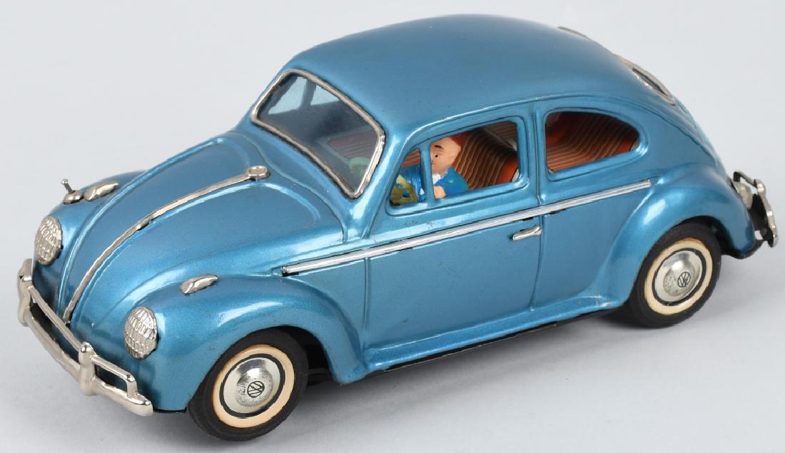 JAPAN TIN Battery Op VOLKSWAGEN w/ VISIBLE ENGINE: Beautiful battery operated Volkswagen Beetle with driver and animated visible engine. Worked when tested. Excellent