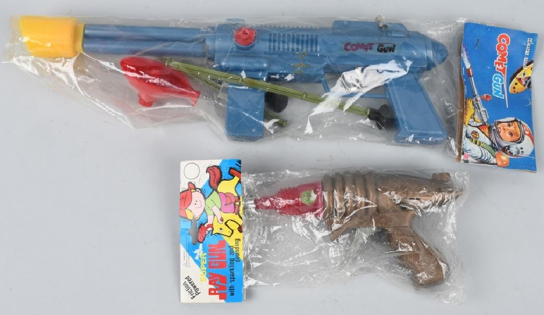 2- SPACE GUNS, ORIGINAL PACKAGING, RAY and COMET: The space Comet Gun rifle is 16" and is in the original packaging. The Ray gun is 7 1/2" and is also in the original packaging. Both re old store stock. Excellent