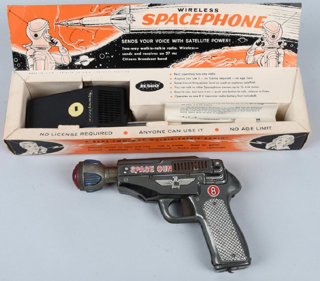 SPACE GUN TIN Battery Op & BOXED SPACE PHONE: The 8" Space Gun is unusual as it is battery operated and the muzzle lights up and moves back and forth. It worked when tested. The Space phone is in the original graphic box. Very Good-Excellent