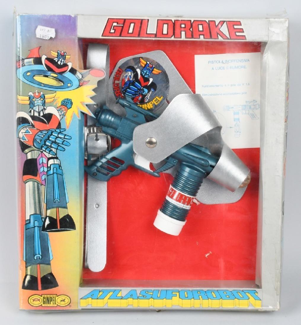 GOLDRAKE ATLASUFOROBOT SPACE GUN, BOXED: Made in Italy and includes the original colorful packaging. Gun is 9" and has a hairline crack in right side of battery compartment. Includes belt, holster and instructions. Box is 16" by 14".Excellen