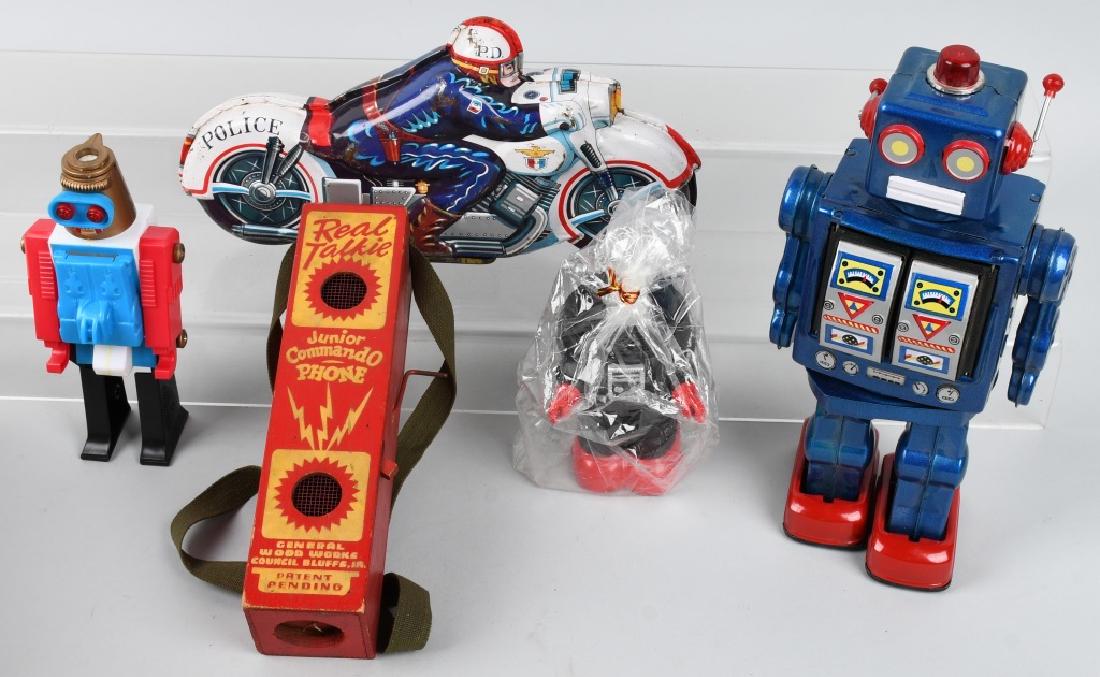 TIN & PLASTIC TOYS, ROBOTS, MOTORCYCLE & MORE: Lot includes 12" Japan motorcycle, a working 12" tin Robot made in China, a plastic 8" Robot squirt gun, a rubber Robot bank, and a WWII era wood Junior Commando Phone. Very Good-Excellent