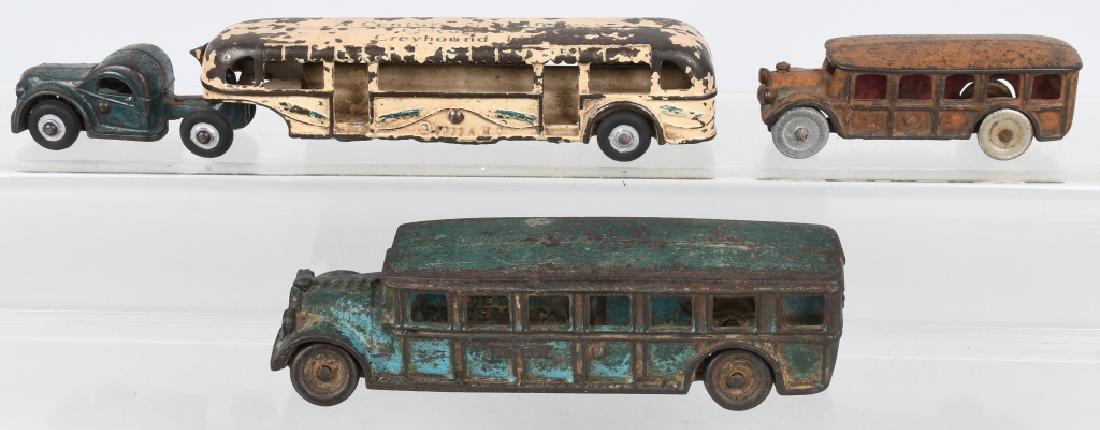 3- 1930'S CAST IRON BUS TOYS: Lot includes a 1933 10 1/2" Arcade World's Fair Bus with replaced rubber tires, a 7 3/4" Arcade Faegol Bus, and a 4 1/2" A.C. Williams Bus with two replaced wheels. Good-Very Good