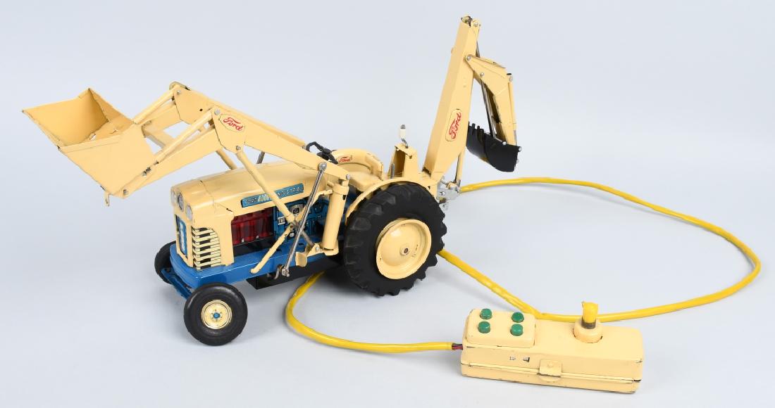 JAPAN Battery Op FORD 4000 INDUSTRIAL TRACTOR: Nice original Japan battery operated Ford 4000 Industrial Tractor with Back Hoe. Great colors and details. Looks all complete. Did not work when tested. 18" Excellent