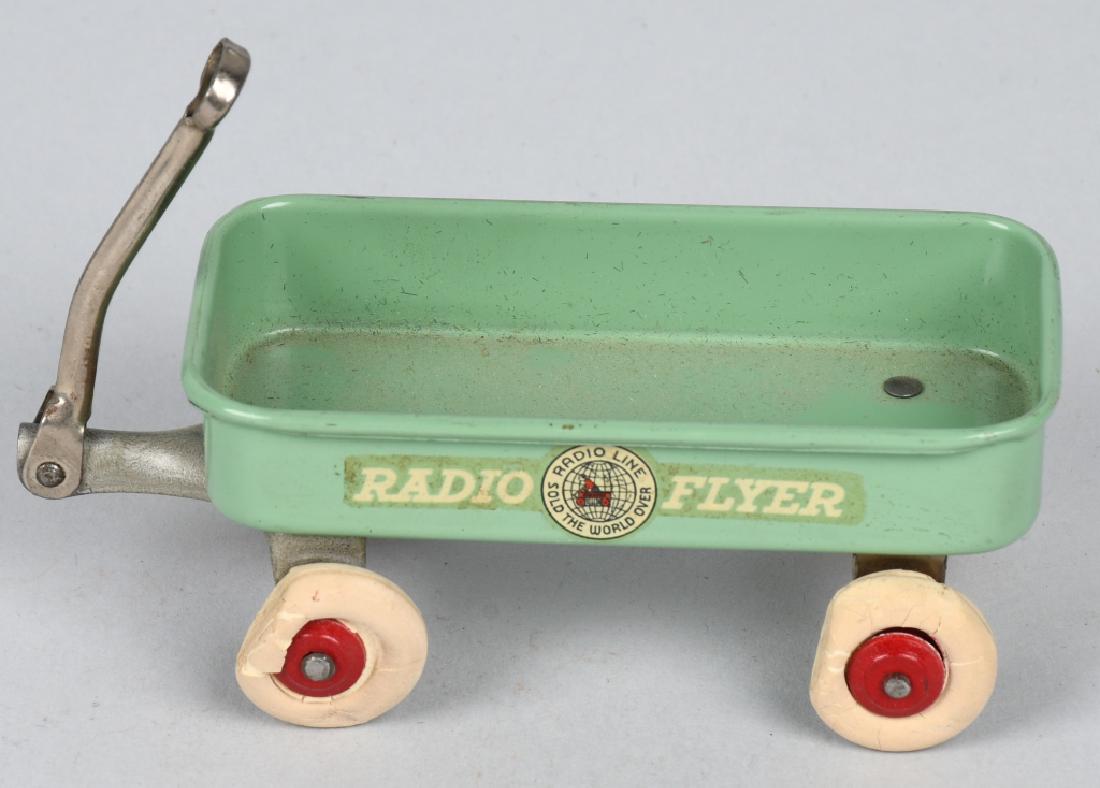 RADIO FLYER MINI WAGON w/ ADVERTISING: Excellent tin Radio Flyer Mini Wagon with Advertising decals on the side. Unusual teal green color. All original 7" Excellent
