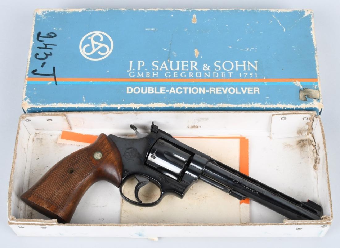 GERMAN J.P SAUER "TROPHY" .38 REVOLVER, BOXED: SN N00688, 6" vented rib barrel with excellent bore. .38 Special caliber. 97% blue finish with excellent walnut checkered grips. Smooth action locks up tight. Includes original box and factory test ta