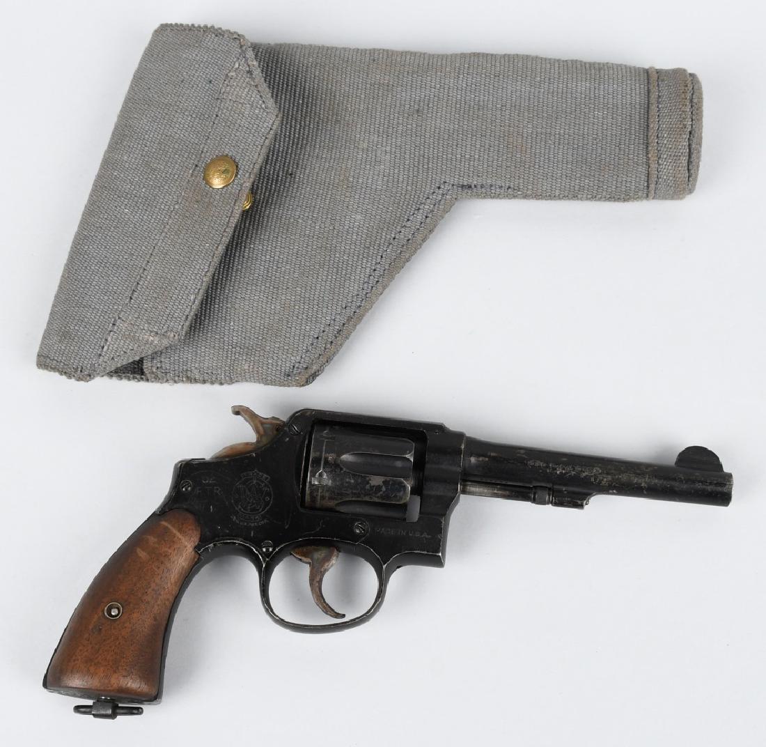 SMITH & WESSON VICTORY MODEL .38 REVOLVER: SN 251386, 5" barrel with excellent bore. Black patented finish with nice markings. Has many British proof marks. Both single and double action work well. Includes canvas British military holster. Ver