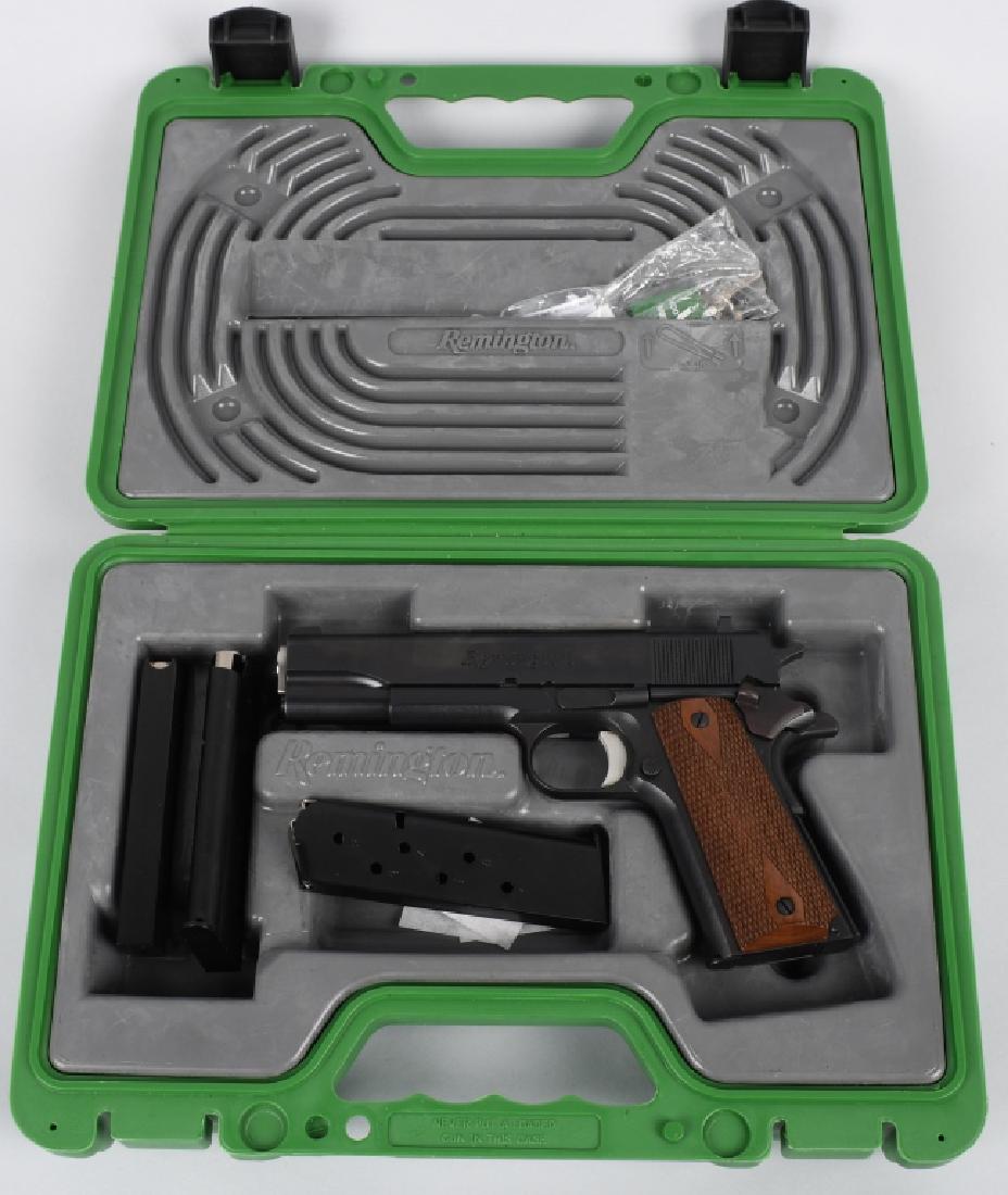 REMINGTON MODEL 1911R1 .45 PISTOL, BOXED: SN RHN82817A, 5" barrel with excellent bore. Excellent finish with excelent checkered wood grips. Appears unfired. Action is crisp. Includes hard case. 3 extra magazines, and gun lock. Near Mint*