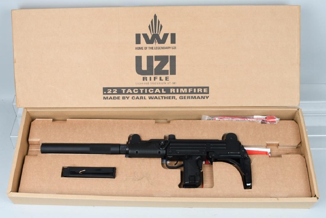 MP UZI ISRAEL .22 SEMI AUTO RIFLE, BOXED: SN W1017937, 18" barrel with excellent bore. .22LR caliber. 99% black matte finish with excellent polymer grips. Action works well. Includes tool, paperwork, 20 round magazine and matching original bo