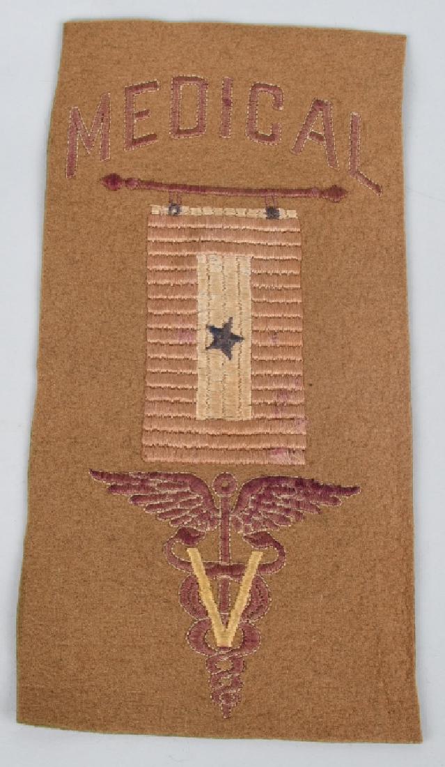 WWI VETERINARY SERVICE "SON IN SERVICE" FLAG: World War One "Son In Service" wool flag - pennant featuring a medical caduceus with the letter "V" signifying Veterinary Service. Flag measures 9.875" x 5". excellent.
