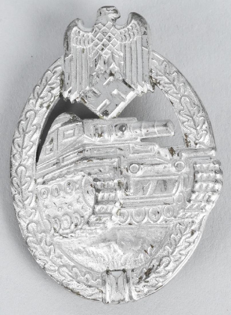 WWII NAZI GERMAN PANZER ASSAULT BADGE IN SILVER: Panzer assault badge in silver. unmarked. The badge is in the form of a vertically oval oak-leaf wreath with a Wehrmacht style eagle with down-swept wings, superimposed to the top center, encompassing