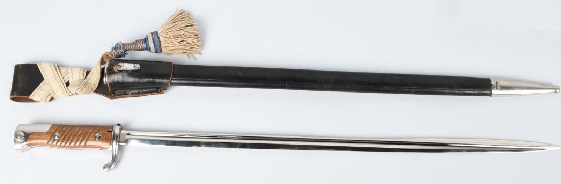 WWI IMPERIAL GERMAN S98 BAYONET W FROG & KNOT: World War One German S98 dress bayonet with scabbard, frog, and blue & white Bavarian sword knot. Ricasso is partially marked "Solingen", the stamping is faint. Blade has never been sharpened and is i