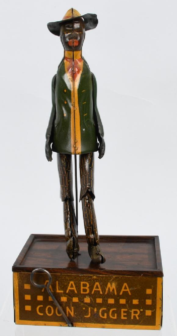 STRAUSS Tin Windup ALABAMA COON JIGGER: Strauss tin windup Alabama Coon Jigger. Green coat version. All original and complete. Nice colors with some normal crazing on base. Works. 10" Very Good-Excellent