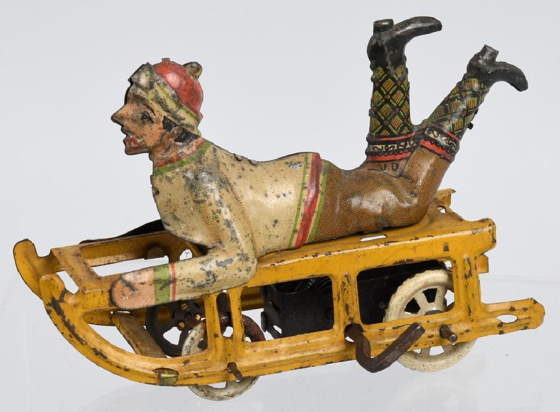 GERMAN Tin Windup BOY ON SLED (1 of 4)