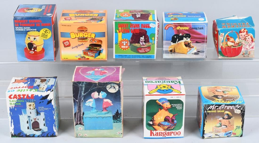 LOT OF VINTAGE BANKS: Includes Bunny Trunk House Bank, Kangaroo Bank, Burger Bank, Monkey Barrel Bank, Castle of Horror bank, Cheese Bank, Mr Greedy Bank, Chicken Feeding bank, and Love Bank. All with boxes. Largest 6 1/2"